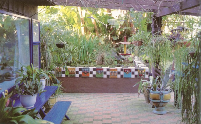 Ceramic tile walls raise The Pool to waist height for easy viewing of water plants and creatures. A carved wooden post supports The Patio trellis. Photograph by RGT