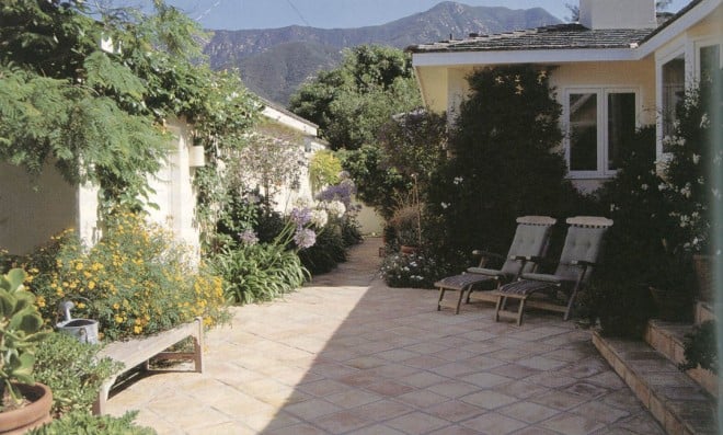 A contemporary interpretation of a Mediterranean courtyard garden, enclosed with walls, paved to save water, furnished for livability, and planted to provide color without excessive water. (Nancy Goslee Power garden, Santa Barbara)