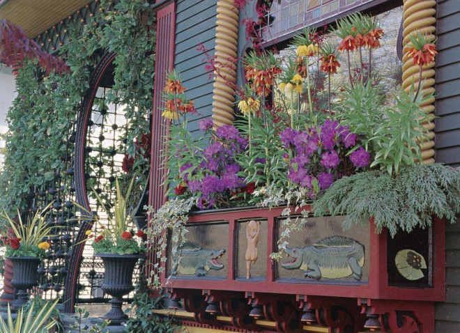 The Seattle home and garden of Brian Coleman and Howard Cohen are filled with details that mark the Victorian age. The plantings are saturated with color that complements the house’s rich color scheme. Garden design by Glen Withey and Charles Price