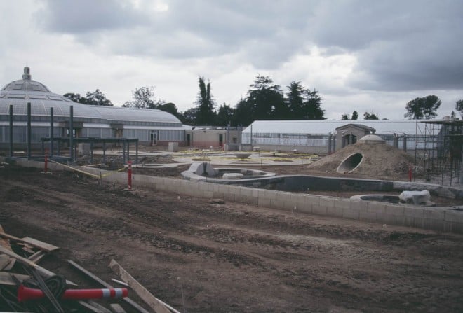 A broad view of the Huntington’s new Botanical Center, with the Rose Hills Foundation Conservatory on the left and the greenhouses on the right; the Helen and Peter Bing Children’s Garden (opening in June 2004) occupies the center of the complex. Photograph by RGT