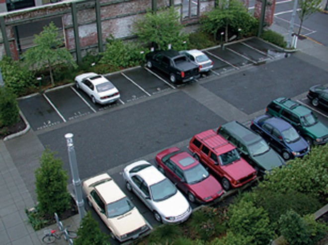 A parking lot at the EcoTrust Building in Portland, Oregon, where petroleumpolluted rainwater drains into adjacent sunken beds planted with native trees and shrubs; there, it is filtered and allowed to replenish the groundwater