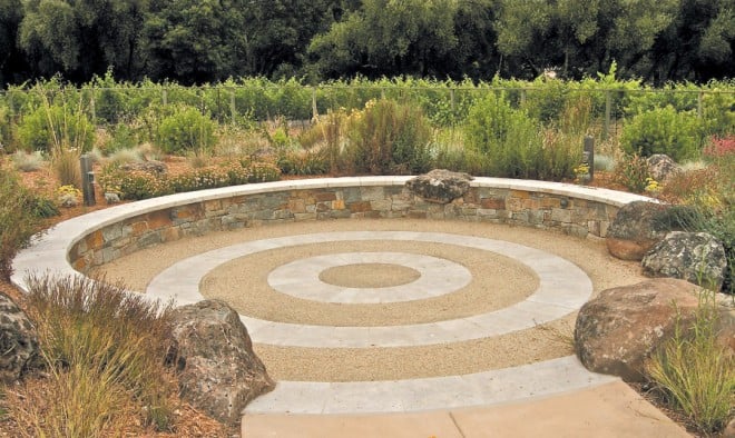 Boulders, typical of Northern California margaritacea have been worked into the stone wall that establishes the Council Ring; beyond is the vineyard and the natural riparian corridor. Photograph by Ted Kipping