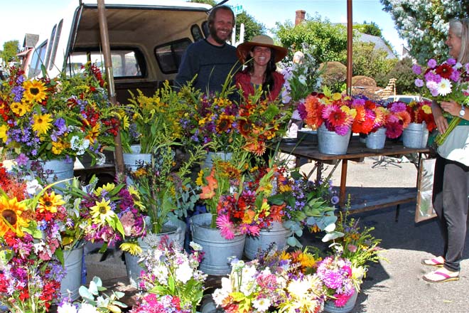 Andy and Winnie surrounded by buckets of blooms at the farmers’ market. Photo: Maria Pitrone Molina/Marisol Photography