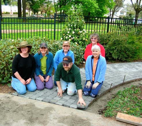 Volunteer board members complete a project at the Portland Memory Garden. Photo: Gary Miranda