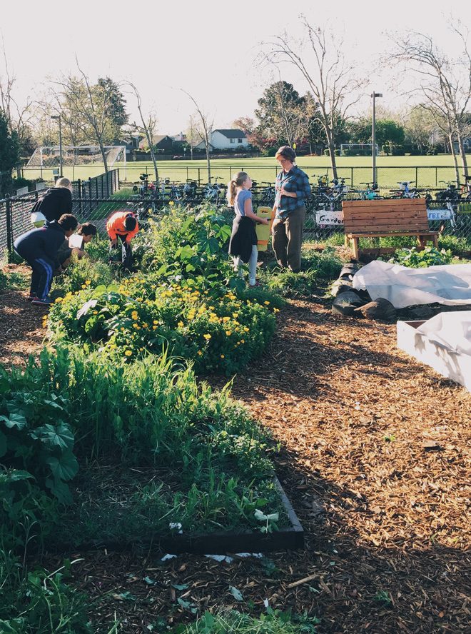 Older students work together on garden tasks... Photo: Ethan Bodnar
