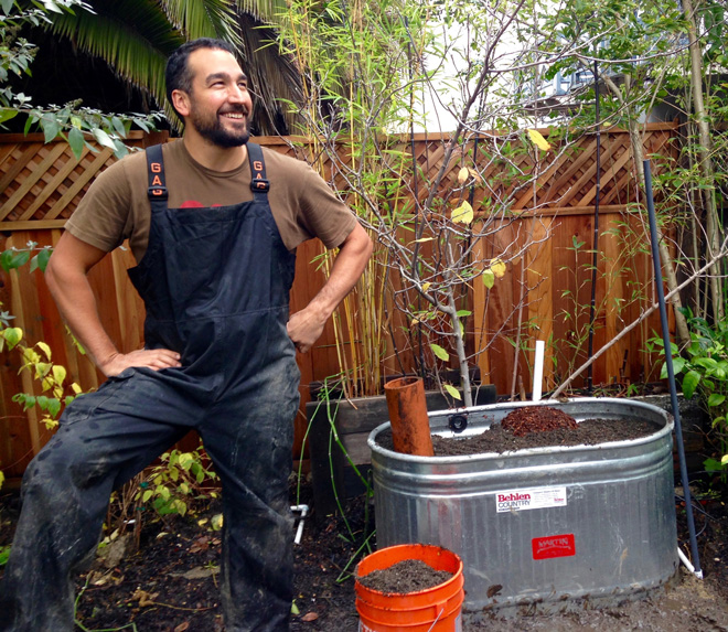 Crew leader Anthony Gutierrez builds a Living Fountain—a Mariposa creation that cleans laundry water by biofiltration. Photo: Andrea Hurd